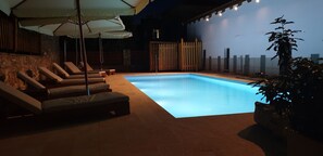 Seasonal outdoor pool, open 11:30 AM to 7:30 PM, pool umbrellas