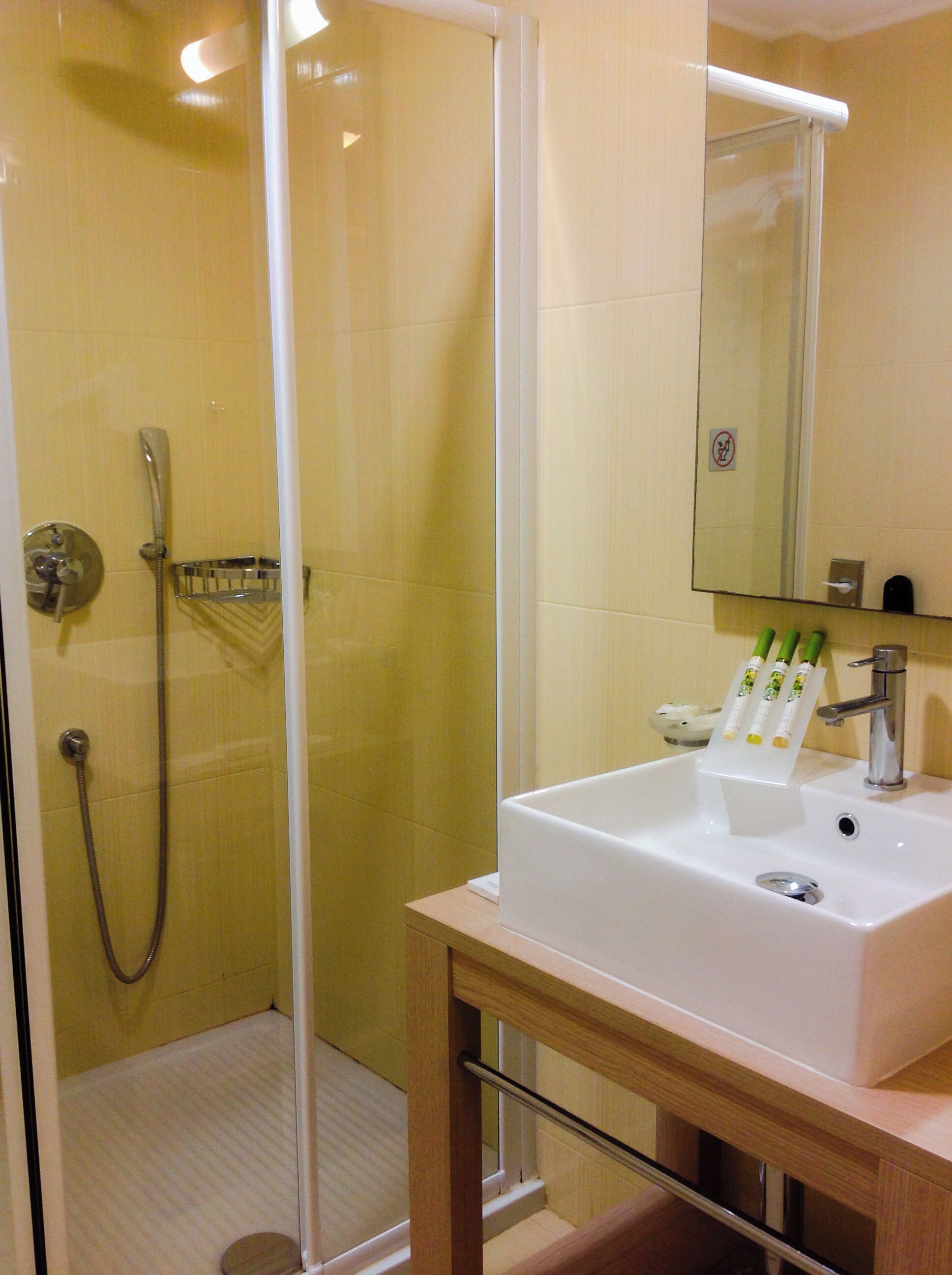 double room, garden view | bathroom | designer toiletries, hair dryer, bathrobes, slippers