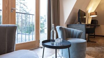 Premium Suite | Living area | 32-inch TV with cable channels