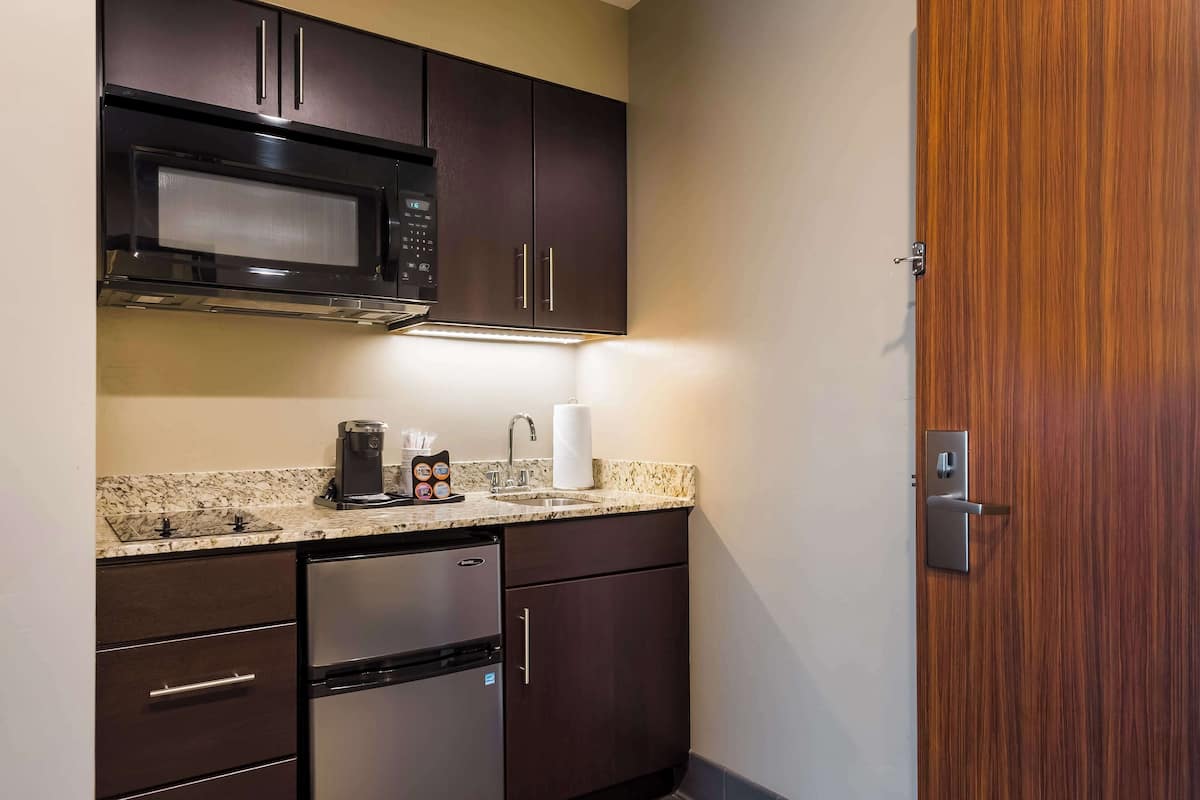 hypo-allergenic bedding, desk, laptop workspace, blackout curtains