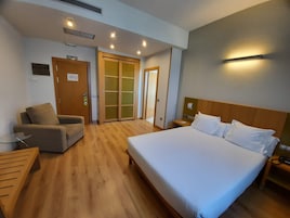 Superior Double Room | Minibar, in-room safe, desk, laptop workspace