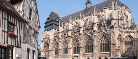 A historic building with Gothic architecture, including pointed arches and intricate stonework.