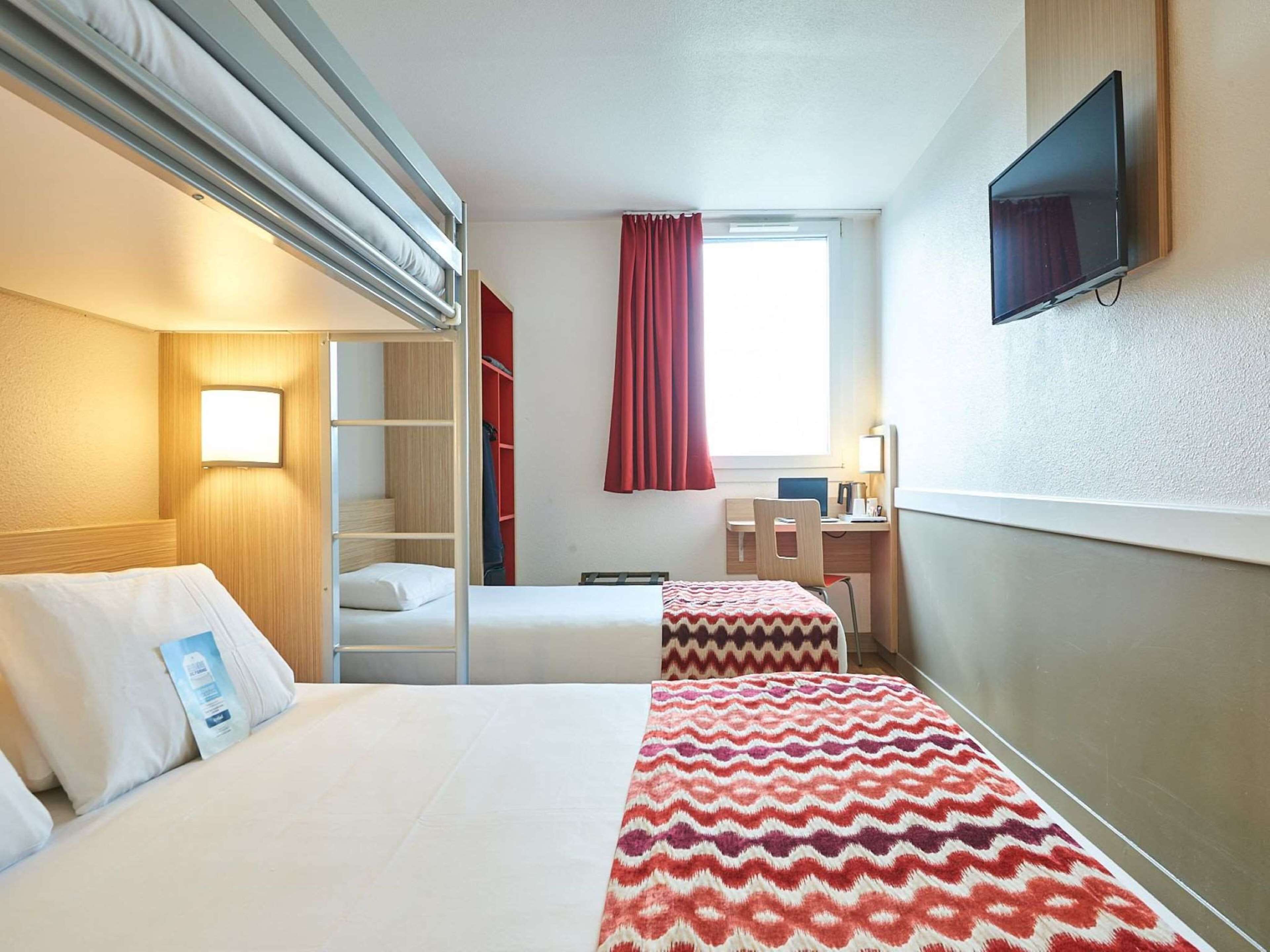 standard room, multiple beds | desk, blackout curtains, soundproofing, iron/ironing board