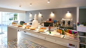 A buffet with various food items and a coffee station. - Albergo del Pino (Cercola)