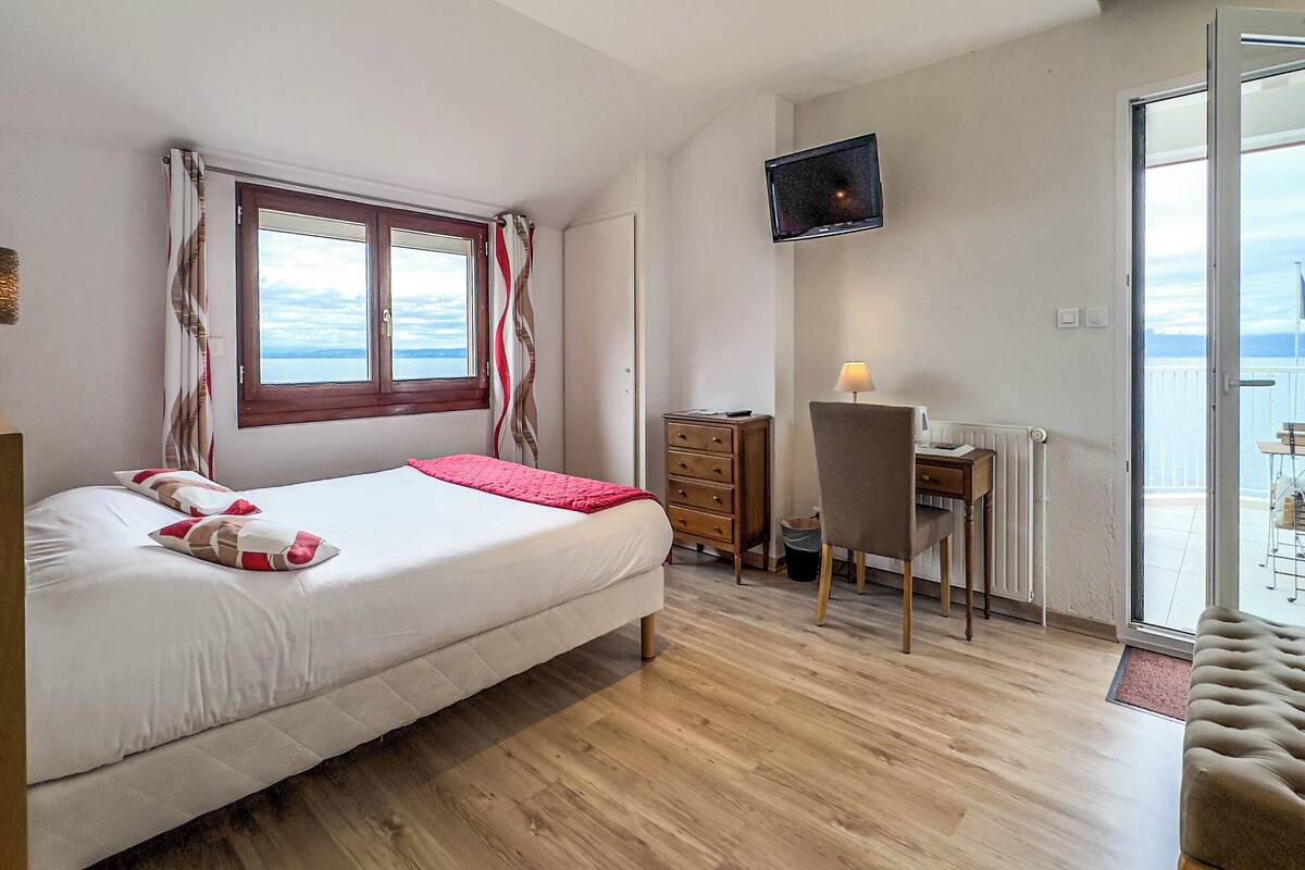 superior room, lake view | premium bedding, in-room safe, desk, laptop workspace