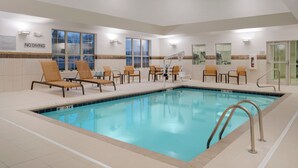 An indoor swimming pool with lounge chairs and a 'NO DIVING' sign. - Courtyard Columbus New Albany (New Albany)