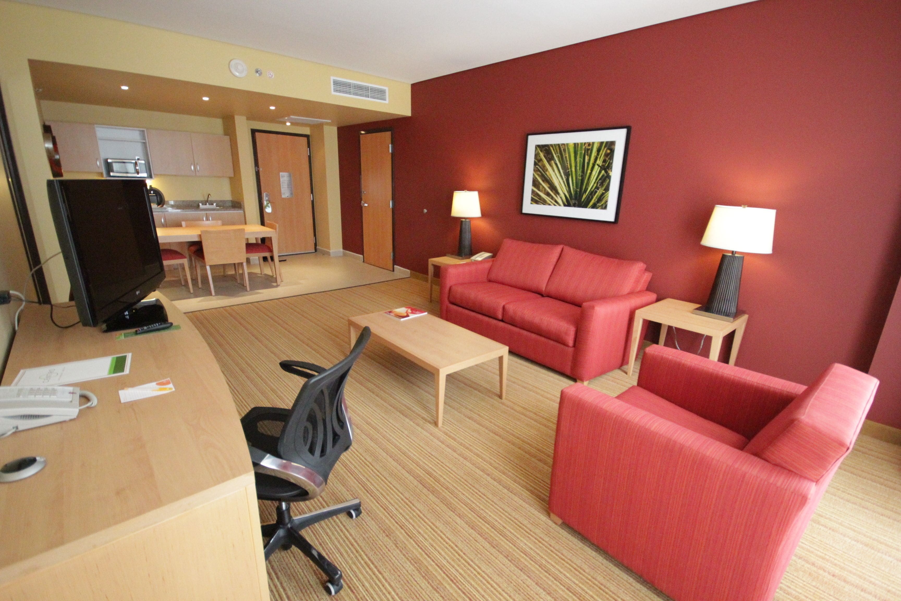 suite, 1 bedroom, non smoking | living area | 37-inch lcd tv with cable channels, tv, ipod dock