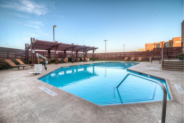 Outdoor pool, open 7:00 AM to 10:00 PM, pool umbrellas, pool loungers
