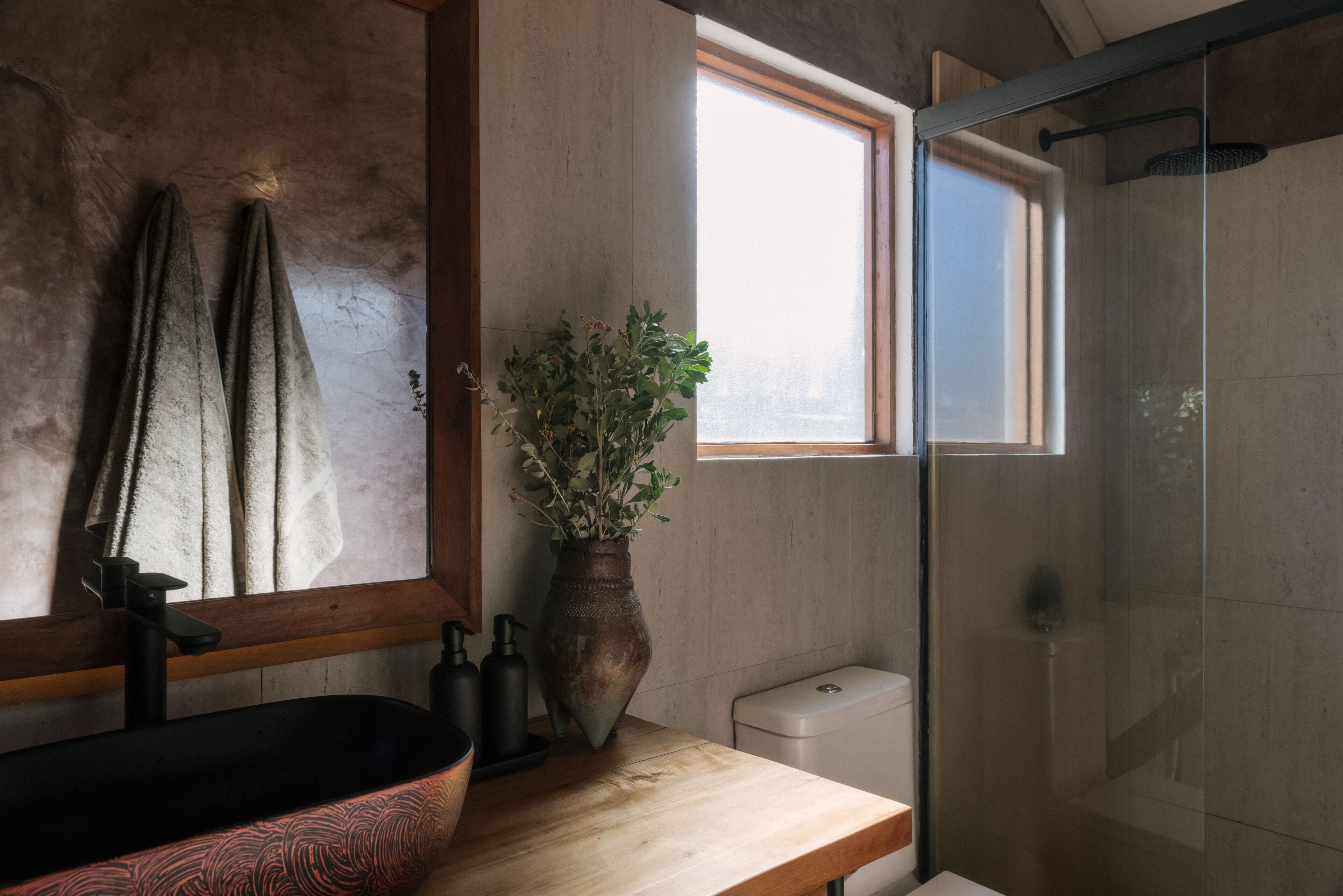 combined shower/bathtub, designer toiletries, hair dryer, bathrobes