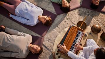 Guests can enjoy a lively musical experience with traditional instruments and mats in a communal setting.