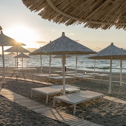 On the beach, beach shuttle, sun-loungers, beach umbrellas