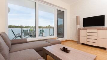 One Bedroom Apartment  | Living room | 32-inch flat-screen TV with cable channels, LCD TV
