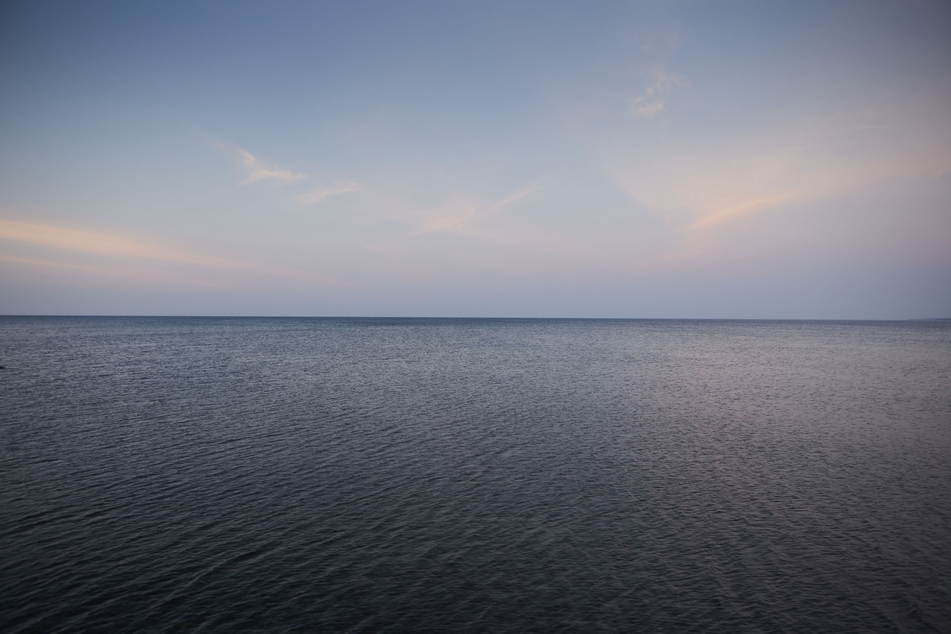 A calm sea under a clear sky.