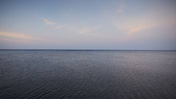A calm sea under a clear sky.