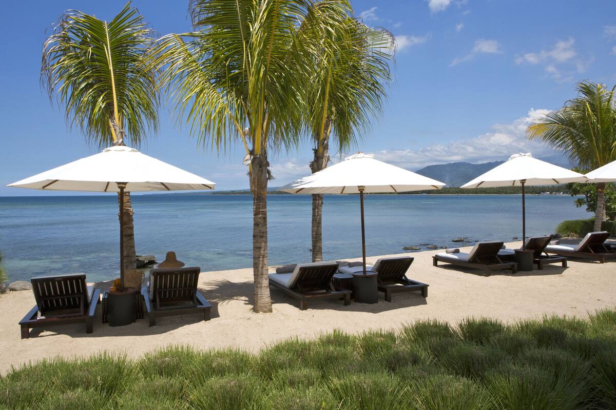 private beach, white sand, sun-loungers, beach umbrellas