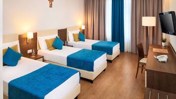 Standard Triple Room | Premium bedding, in-room safe, desk, blackout drapes