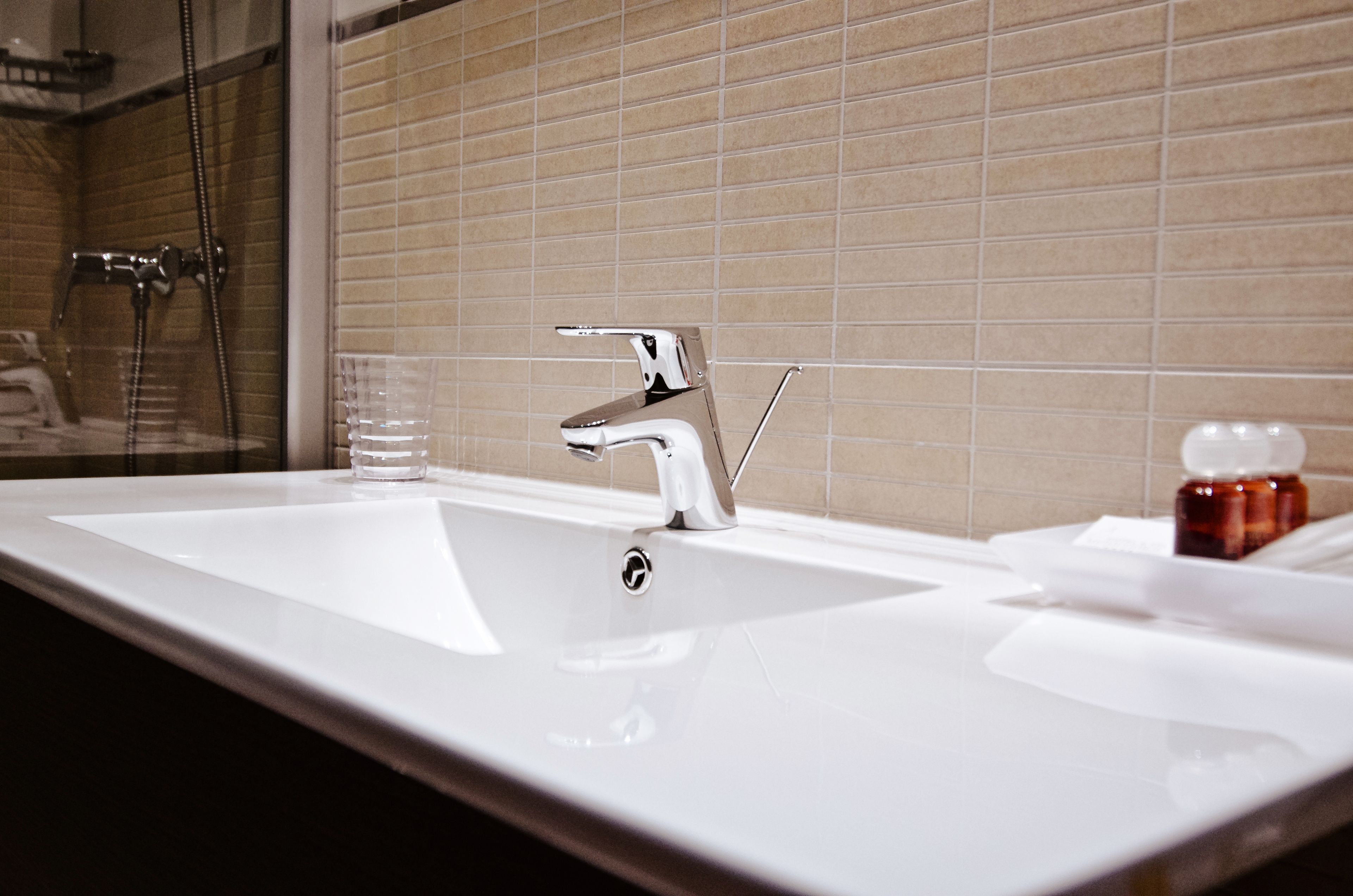 shower, designer toiletries, hair dryer, slippers