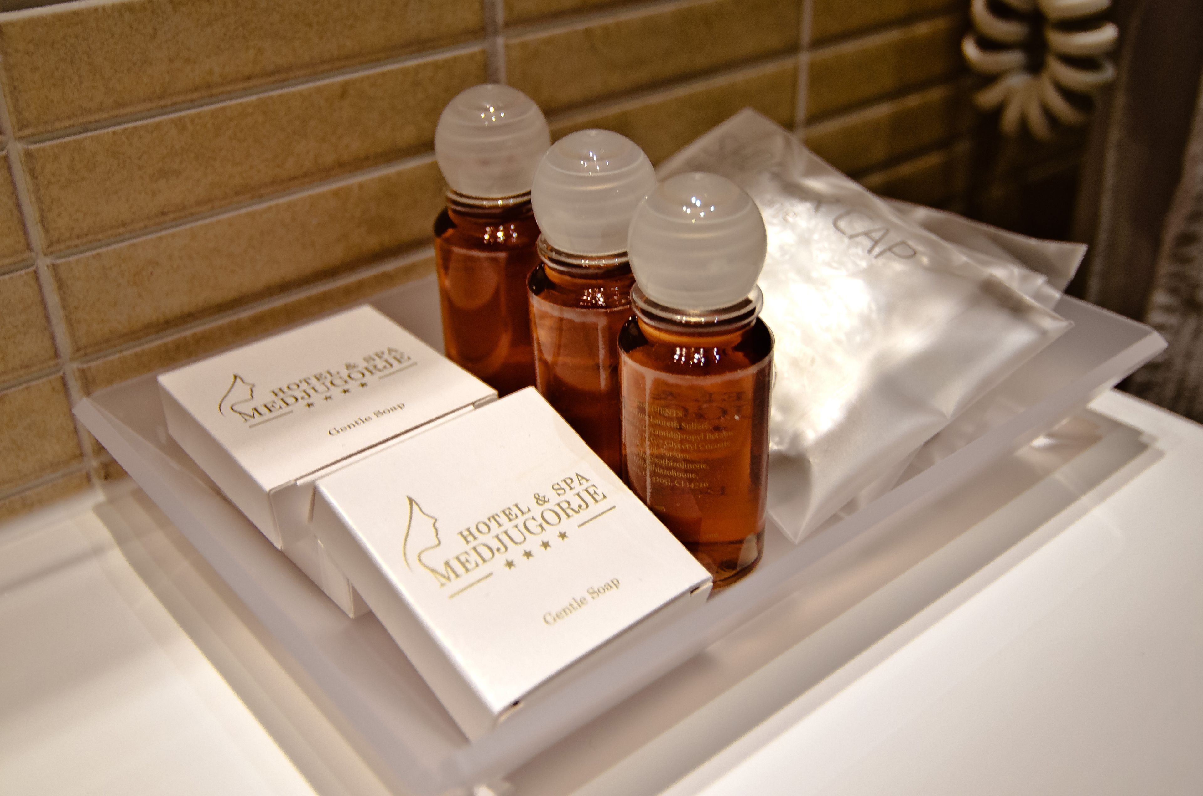 shower, designer toiletries, hair dryer, slippers