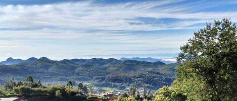 A mountainous landscape with a town in the valley.