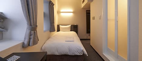 Down comforters, desk, blackout drapes, iron/ironing board