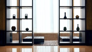 A modern interior with a reflective floor, a large window, and shelves displaying various vases and pottery. - Hotel Consort Shin-Osaka (Osaka)