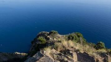 A rocky coastline with a clear view of the sea.