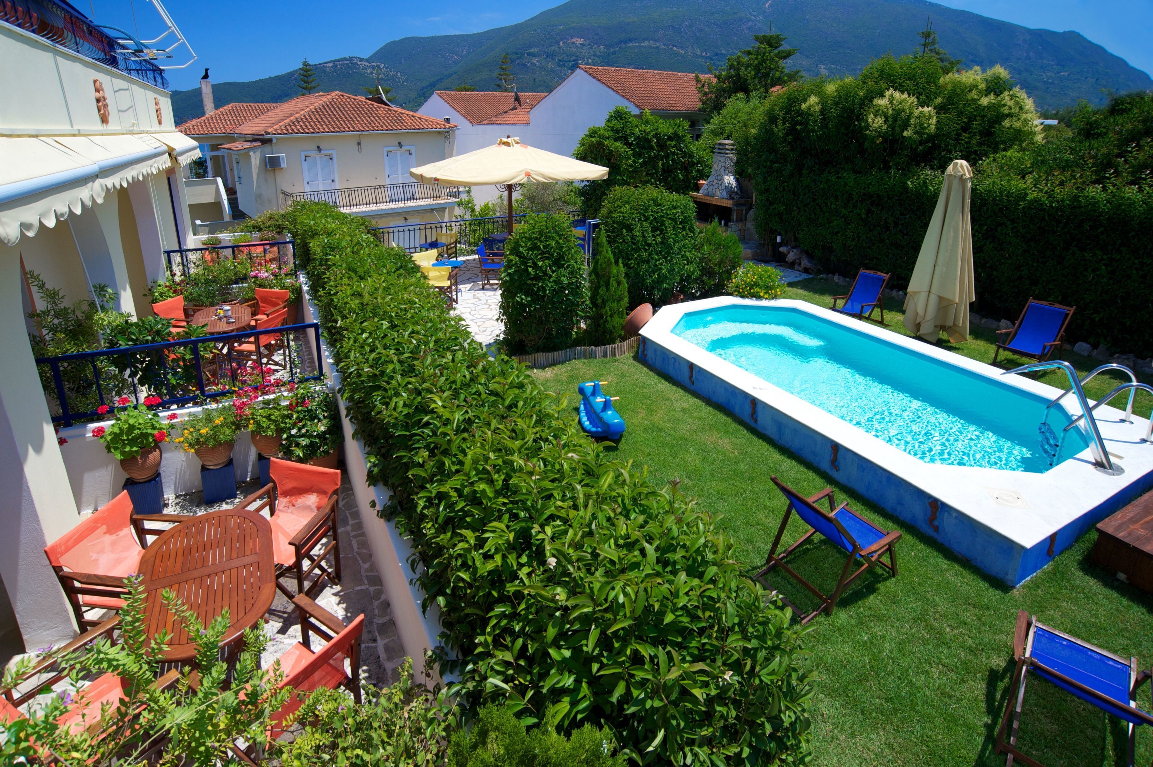 Seasonal outdoor pool, open 10:00 AM to 8:00 PM, pool umbrellas