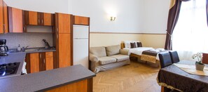 Deluxe Apartment, 1 Bedroom | Living room | TV