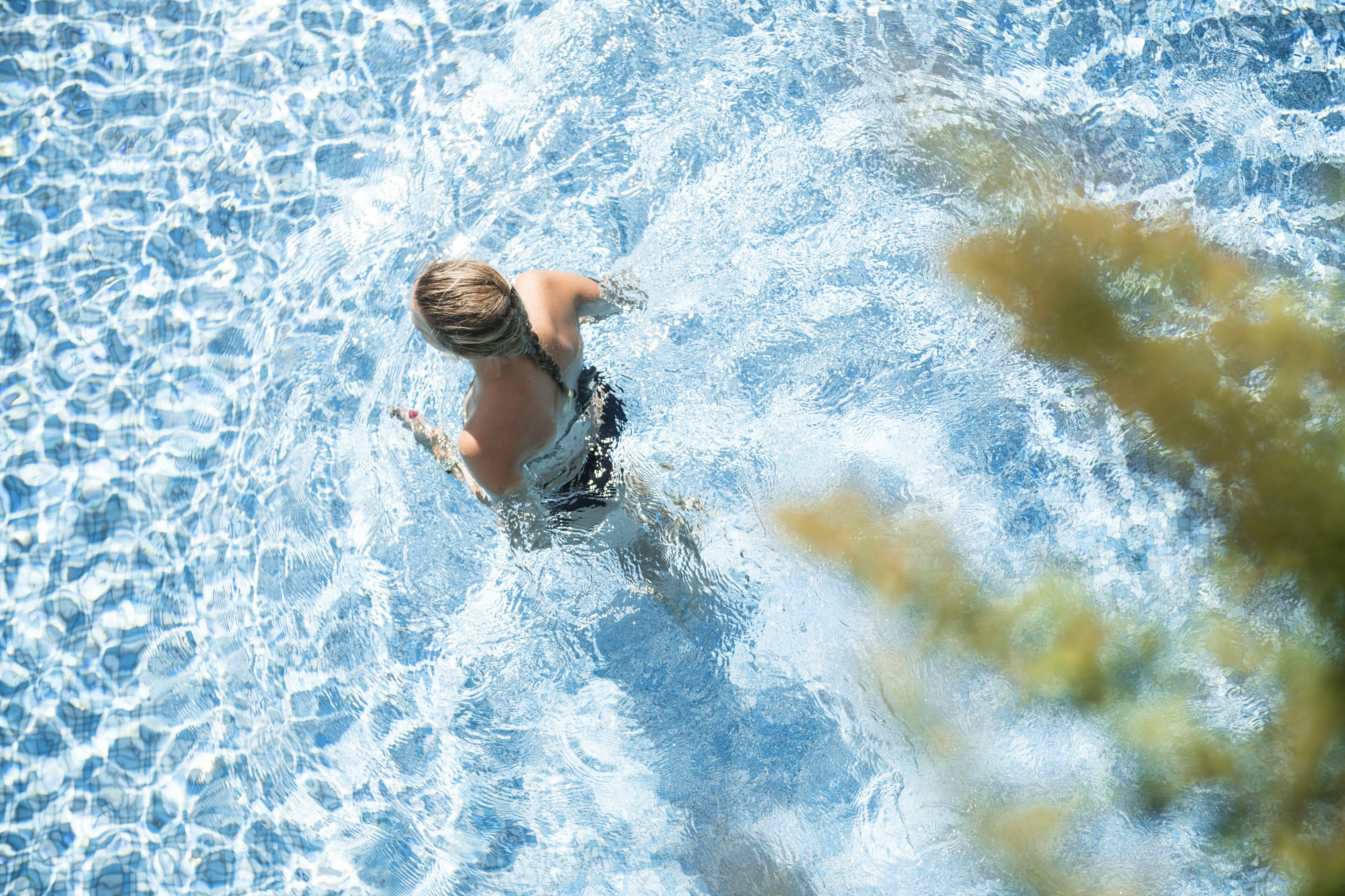 A person swimming in a pool.