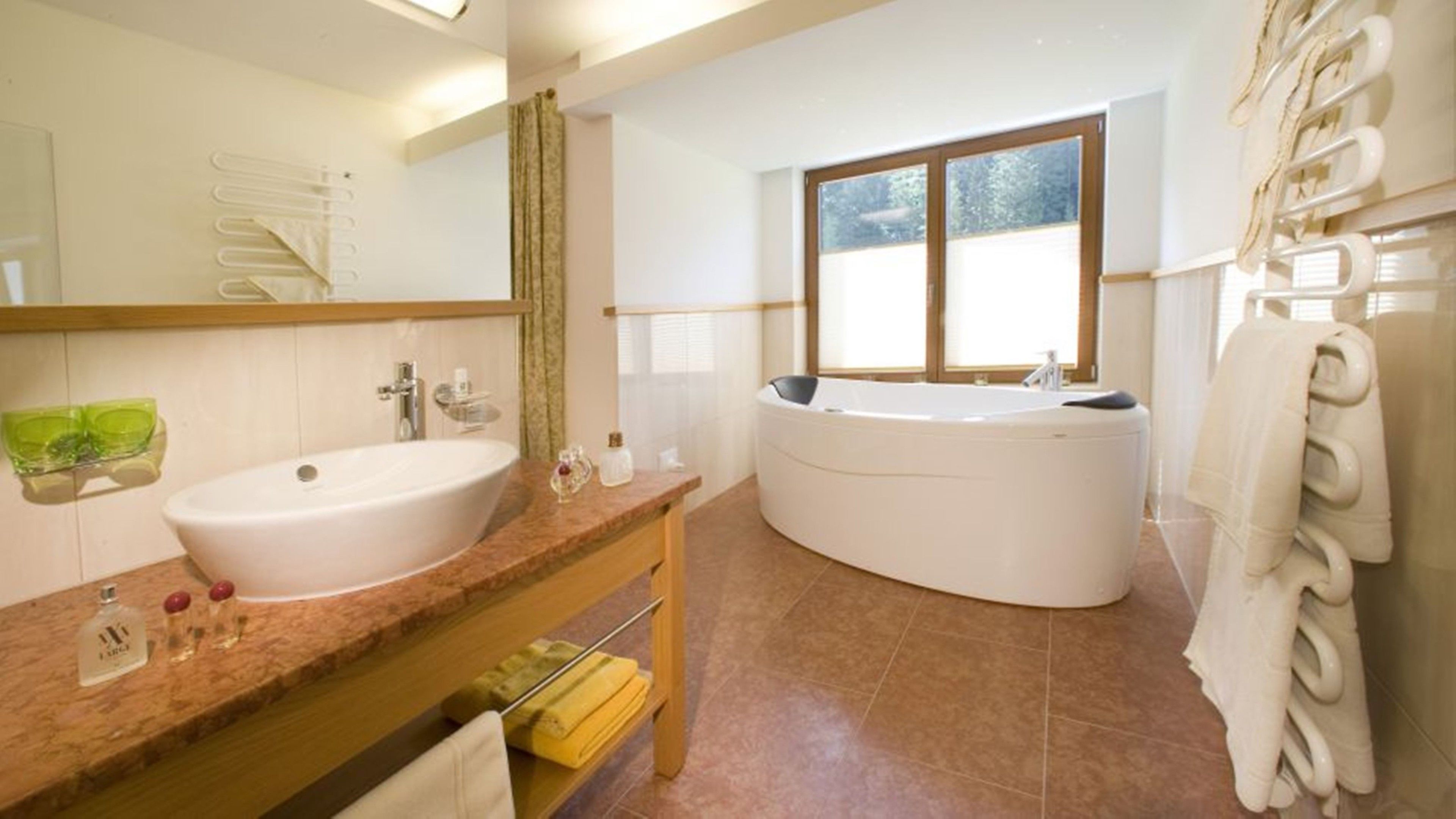 luxury suite, balcony | bathroom | hair dryer, bathrobes, slippers, towels