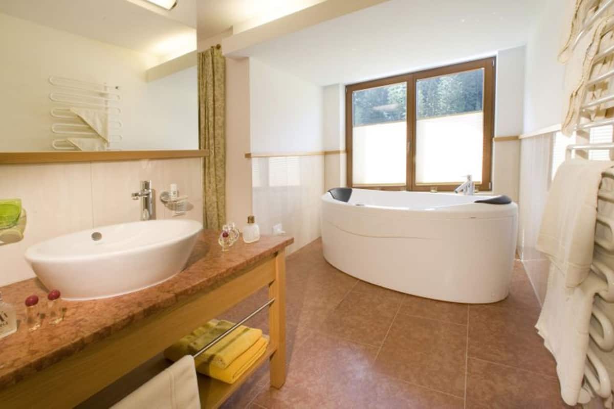luxury suite, balcony | bathroom | hair dryer, bathrobes, slippers, towels