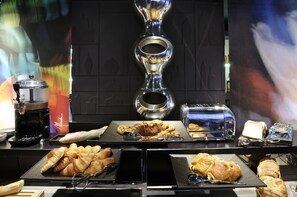 A breakfast buffet with croissants, bread, and a coffee machine. - Best Western Premier Why Hotel (Lille)