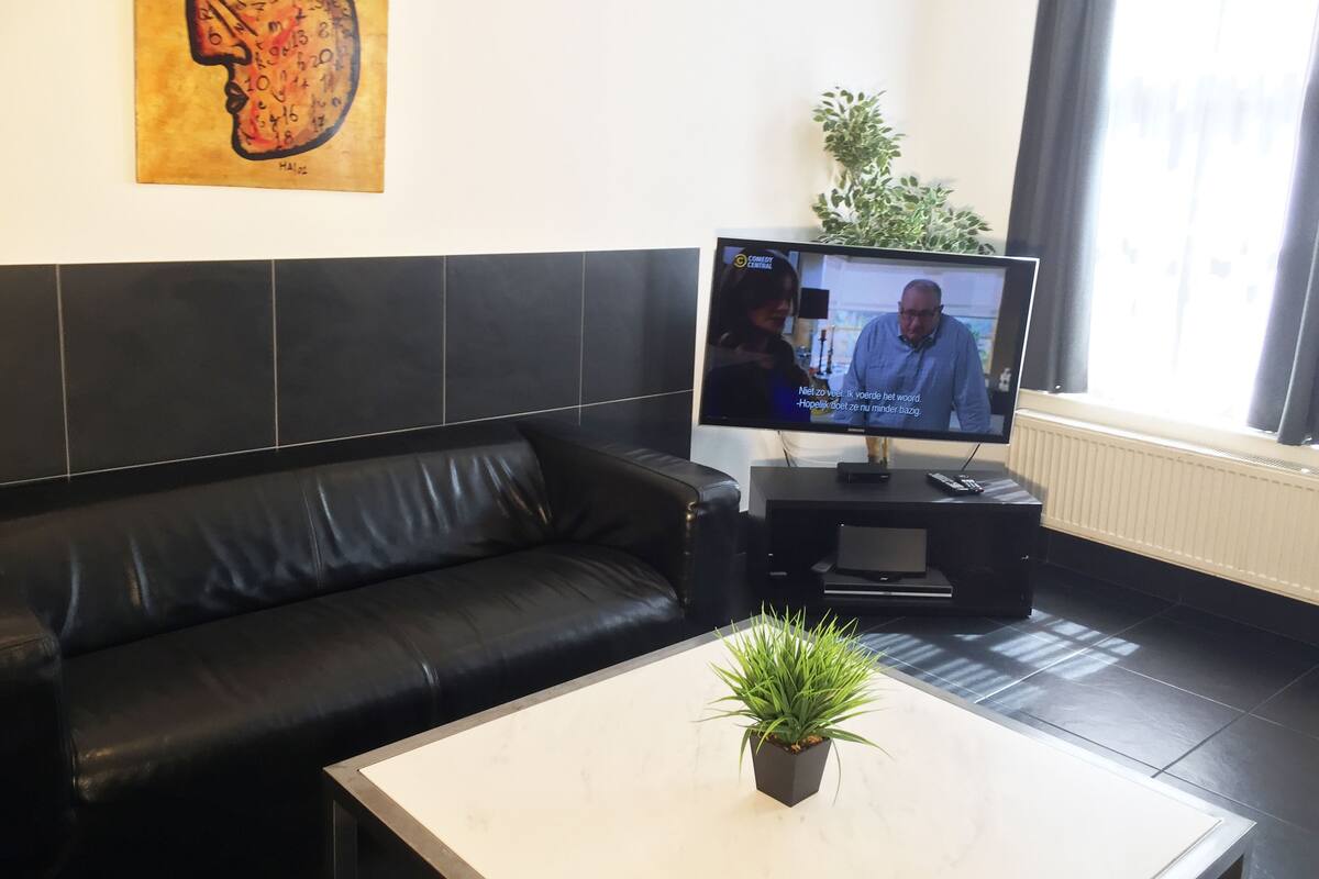 Apartment, 3 Bedrooms, Balcony | Living room | Flat-screen TV