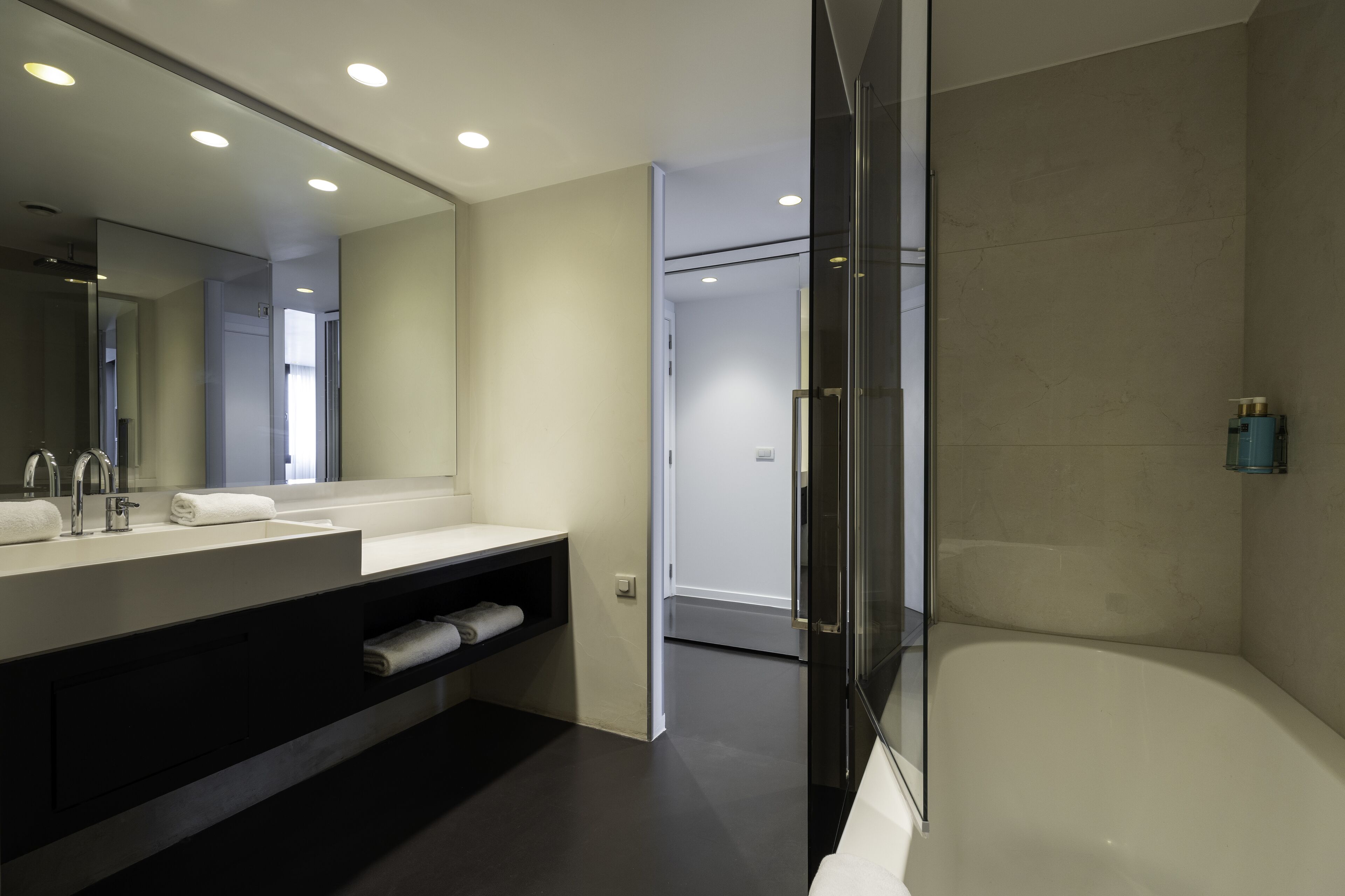 rainfall showerhead, designer toiletries, hair dryer, towels