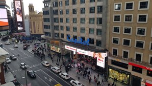 A busy urban street with a hotel named Capitol. - Main Street Madrid (Madrid)