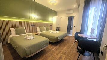 Family Triple Room | Down duvets, in-room safe, blackout curtains, soundproofing