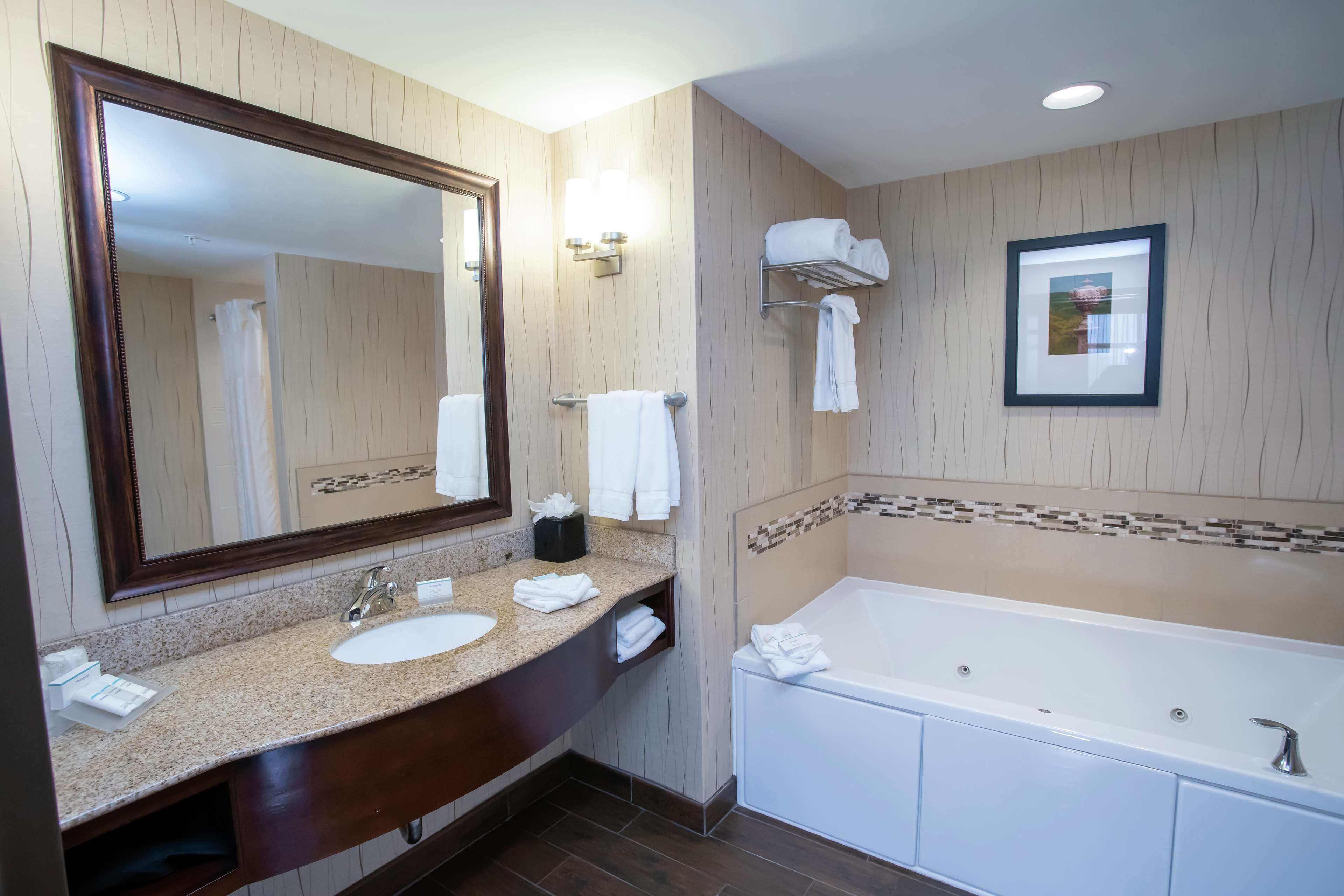 king 2 room larger suite | bathroom | combined shower/bathtub, free toiletries, hair dryer, towels