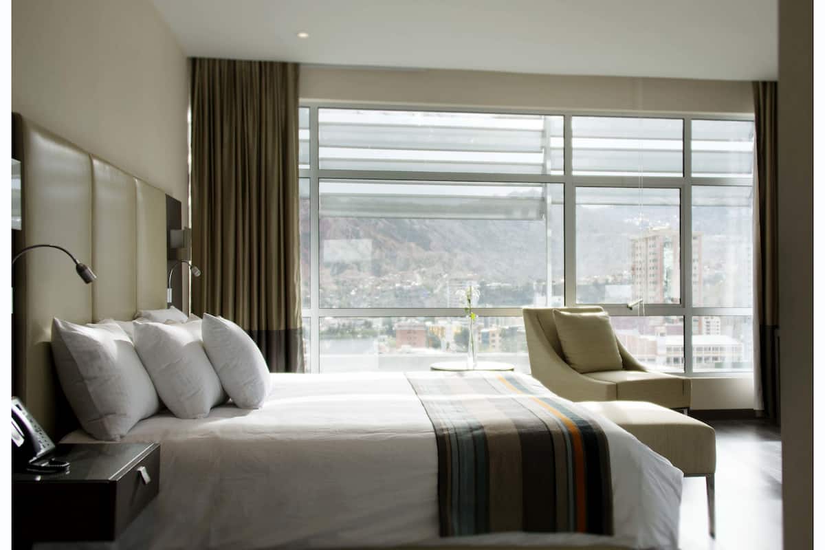 deluxe room | minibar, in-room safe, desk, blackout curtains