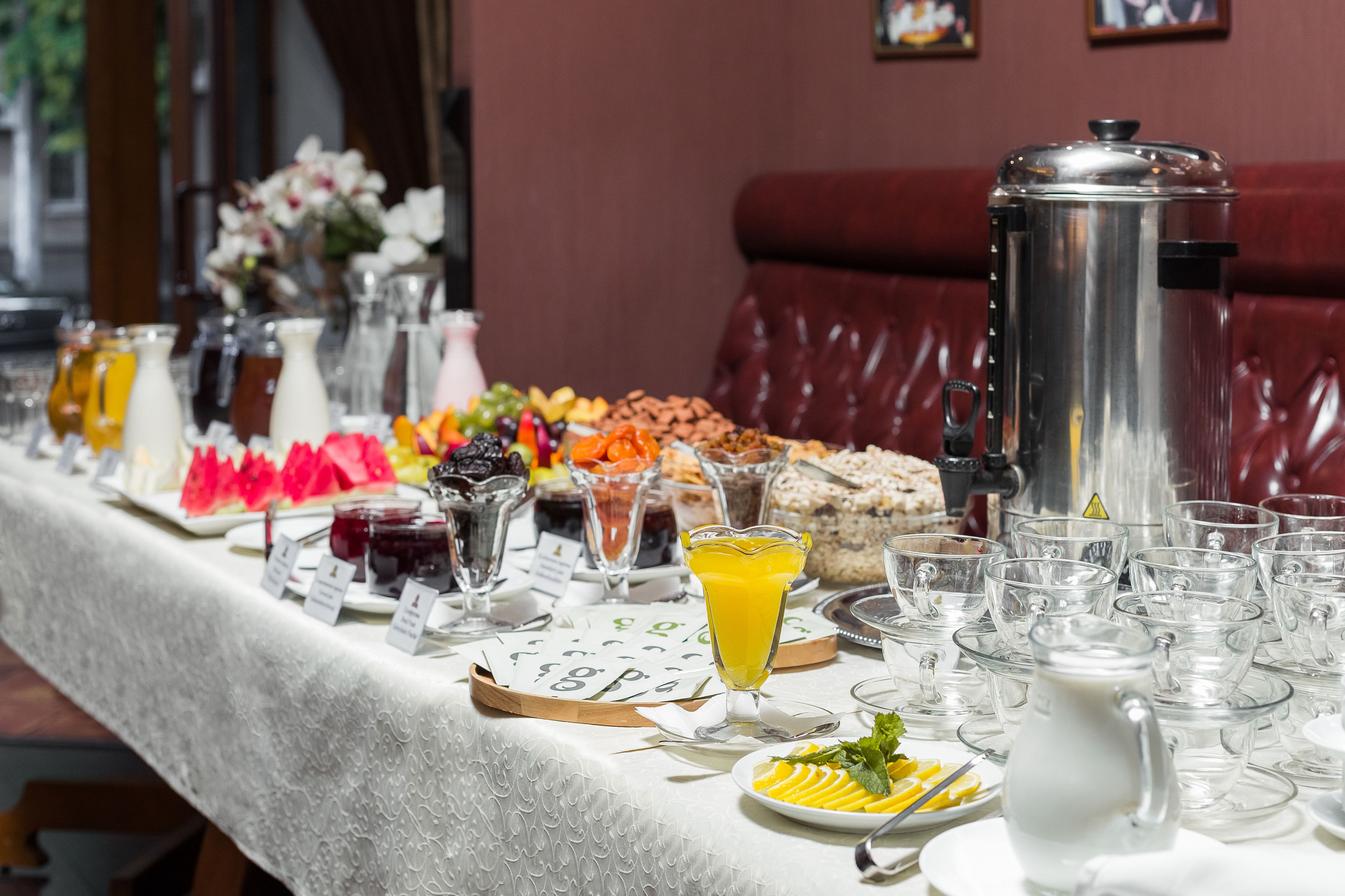 A breakfast buffet with various food items and beverages.