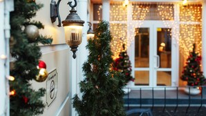 A building with a reception area, decorated with Christmas lights and a Christmas tree. - Odesskiy Dvorik (Odesa)