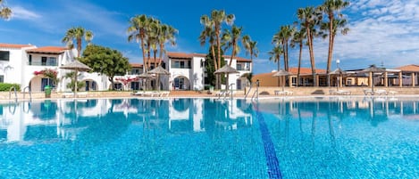 Seasonal outdoor pool, pool umbrellas, pool loungers