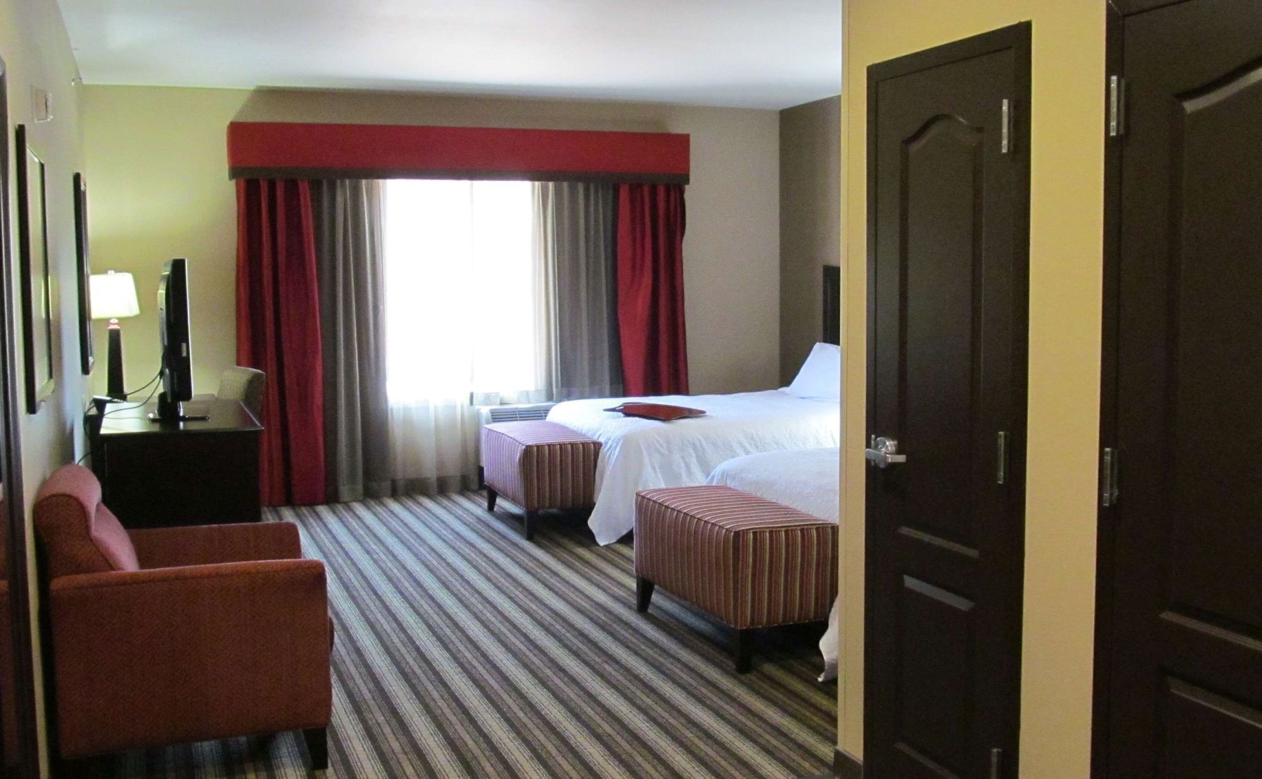 Premium bedding, pillow-top beds, blackout curtains, iron/ironing board