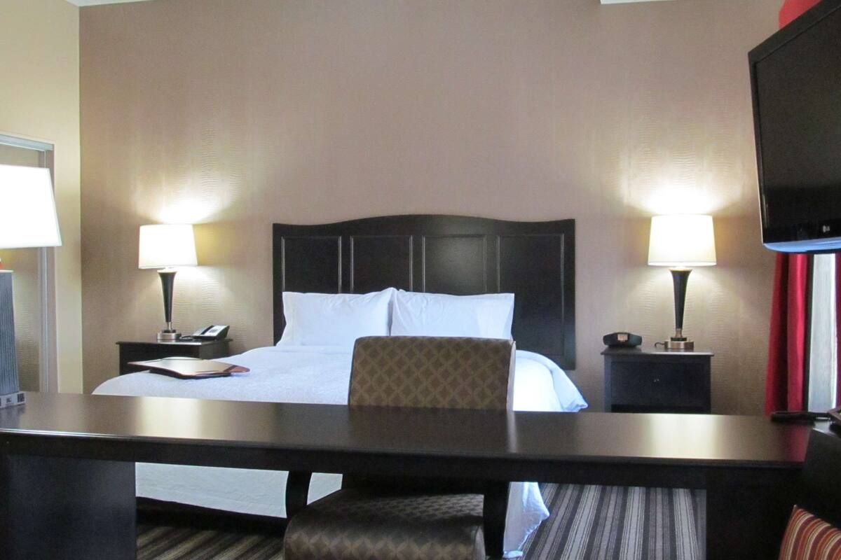 king studio suite | premium bedding, pillow-top beds, blackout curtains, iron/ironing board