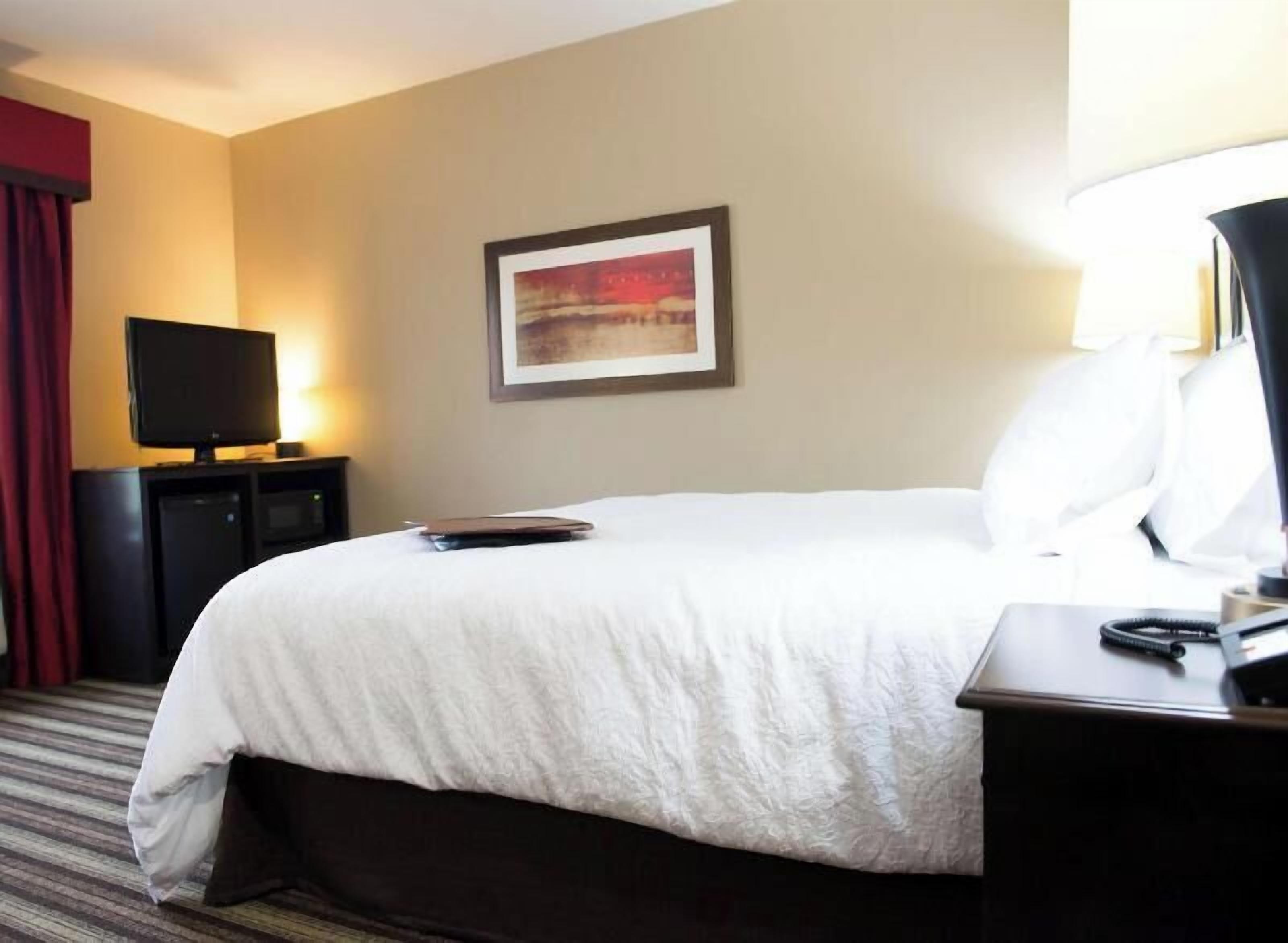 Premium bedding, pillow-top beds, blackout curtains, iron/ironing board