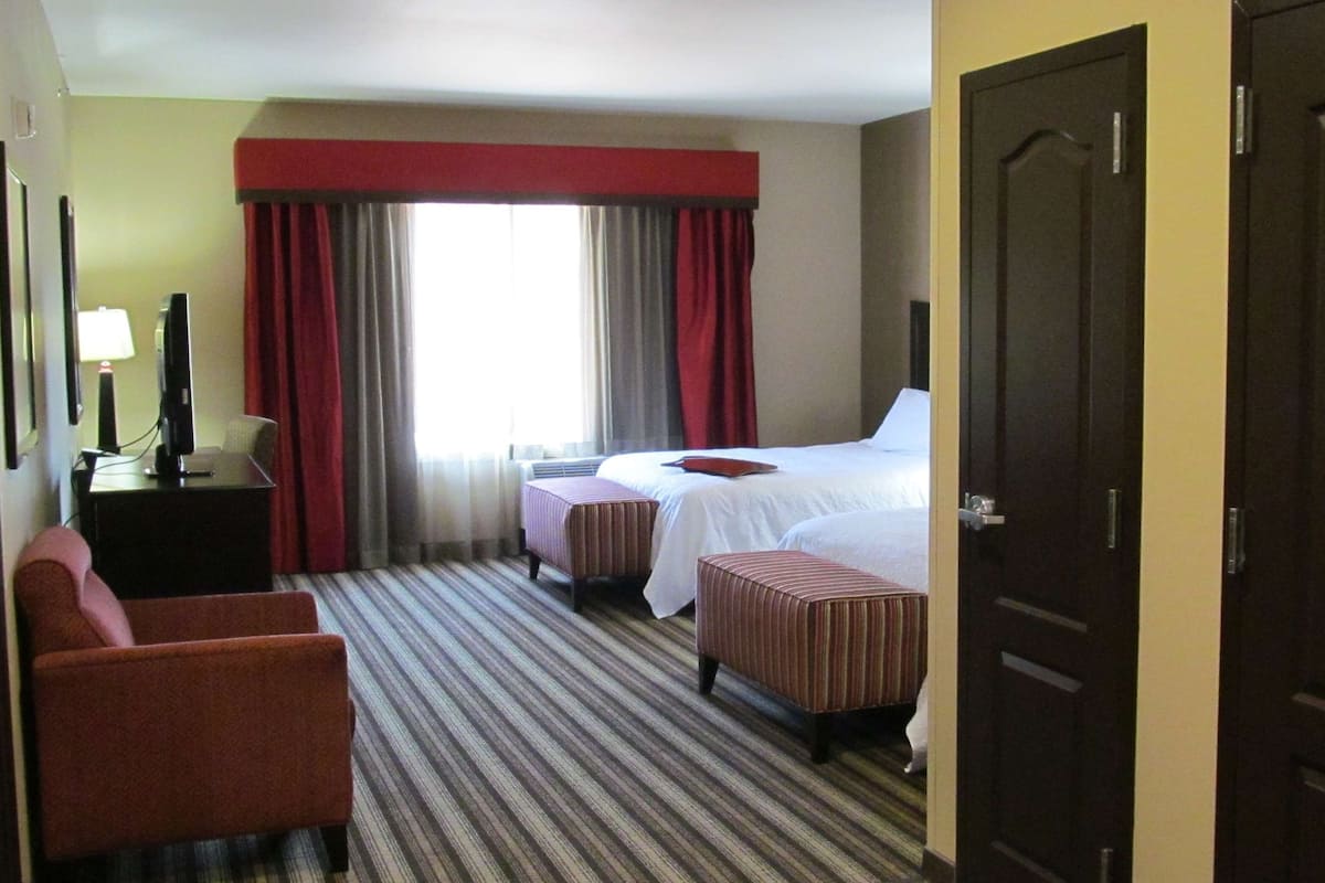 Premium bedding, pillow-top beds, blackout curtains, iron/ironing board