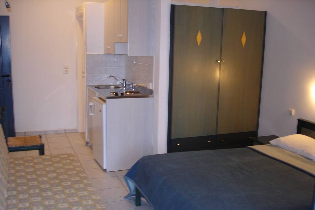 Triple Room, Garden View | Iron/ironing board, free cots/infant beds, free rollaway beds, free WiFi