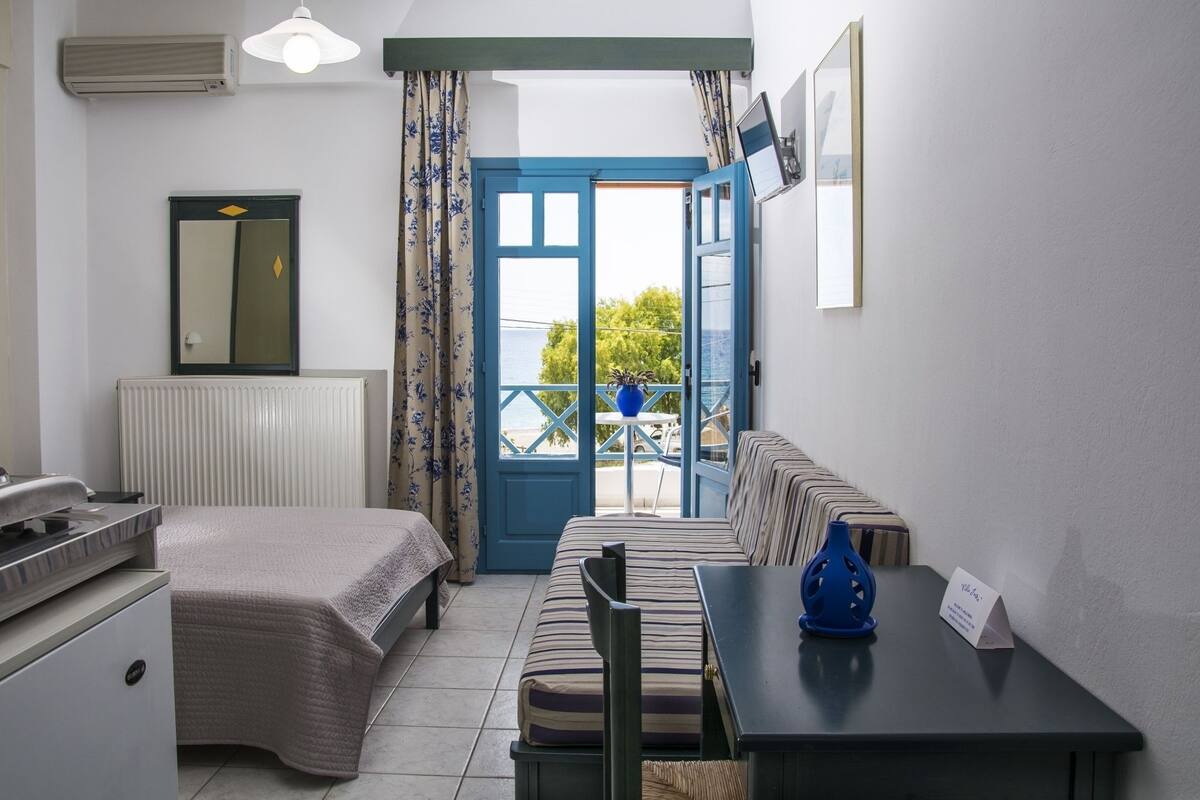 Triple Room, Sea View | Iron/ironing board, free cots/infant beds, free rollaway beds, free WiFi