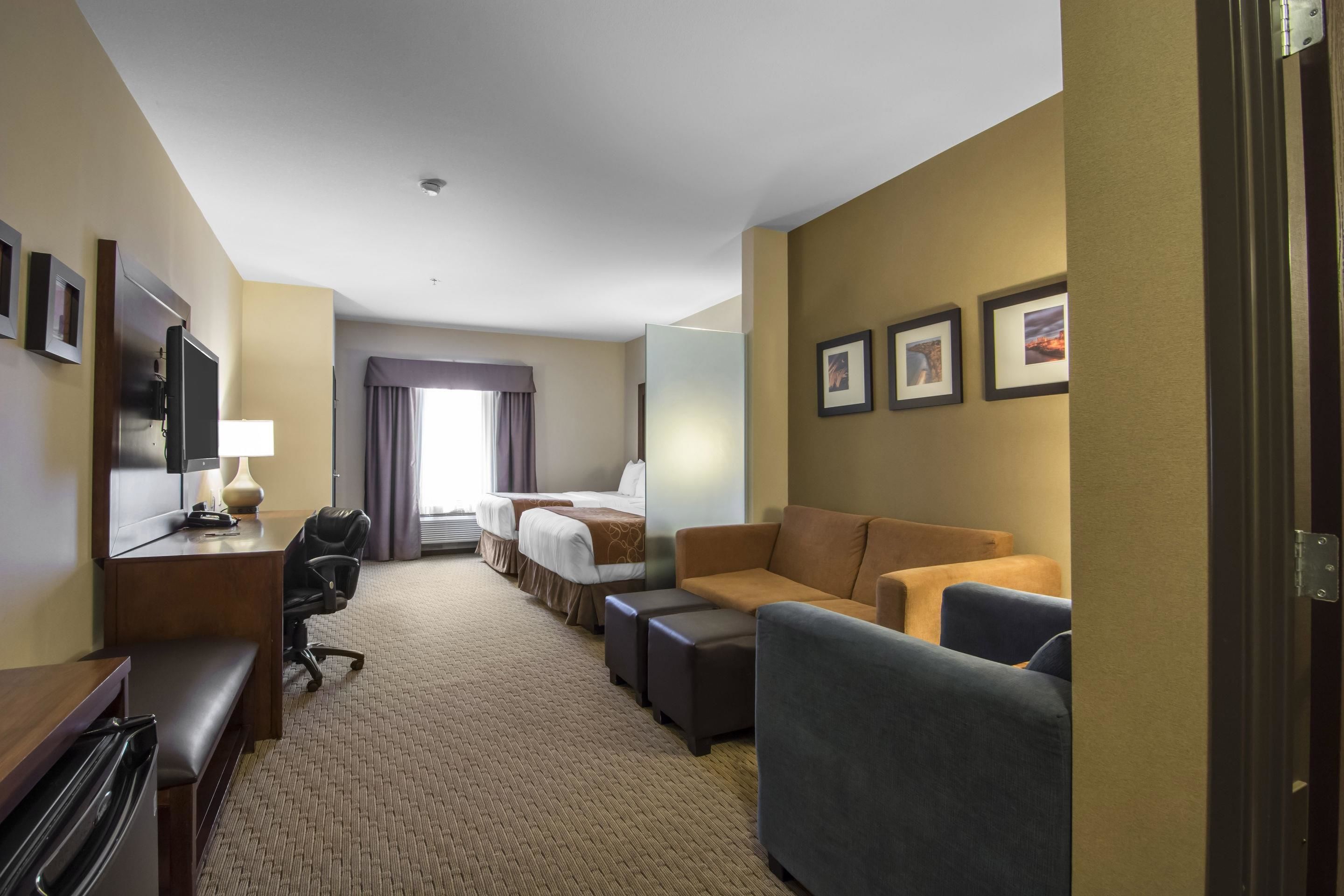 suite, 2 queen beds, non smoking | in-room safe, desk, laptop workspace, blackout curtains