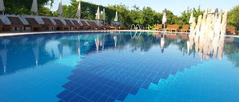 Indoor pool, 3 outdoor pools, pool umbrellas, sun loungers