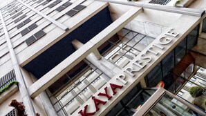 A building with a prominent sign reading "KAYA PRESTIGE". - Kaya Prestige (Izmir)